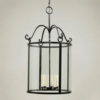Rustic hall lantern with candles, clear side view.