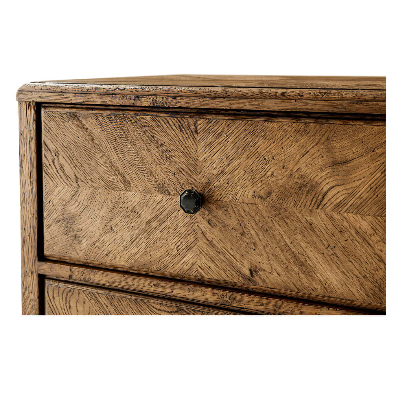 Close-up of drawer knob on rustic oak nightstand.
