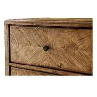 Close-up of drawer knob on rustic oak nightstand.
