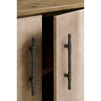 Close-up of open doors on rustic leather credenza.