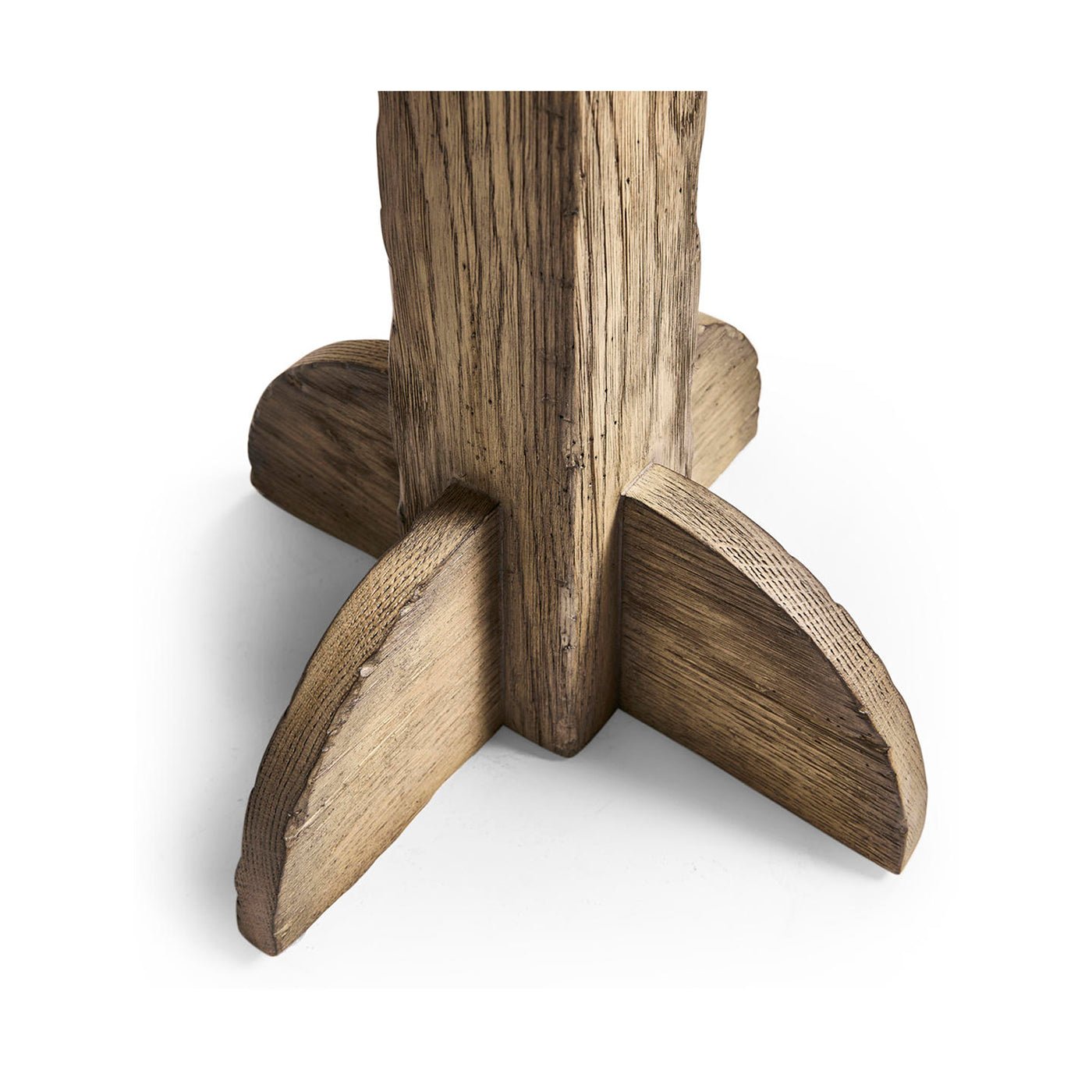 Close-up of table's wooden pedestal base details.