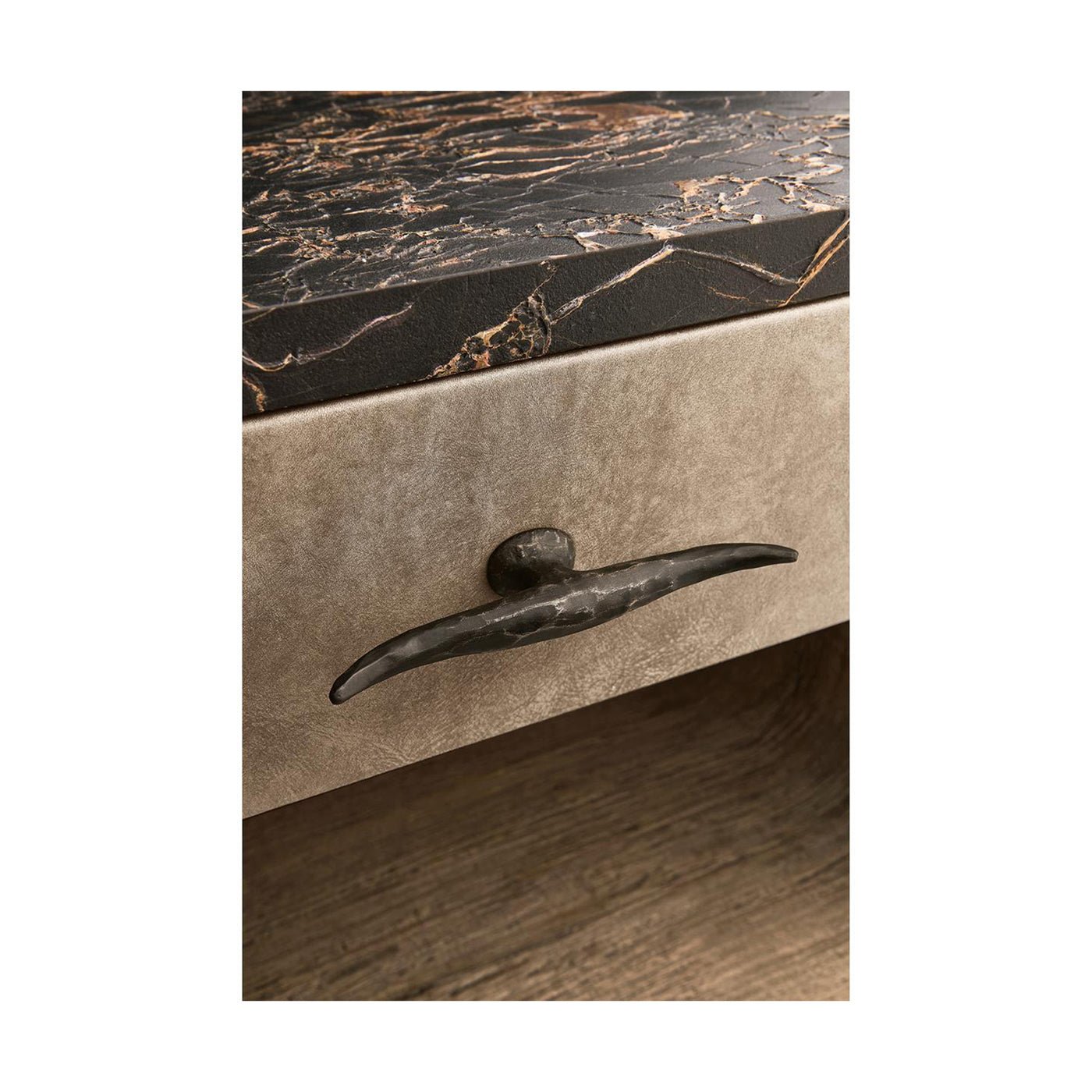 Close-up of drawer handle on rustic nightstand.