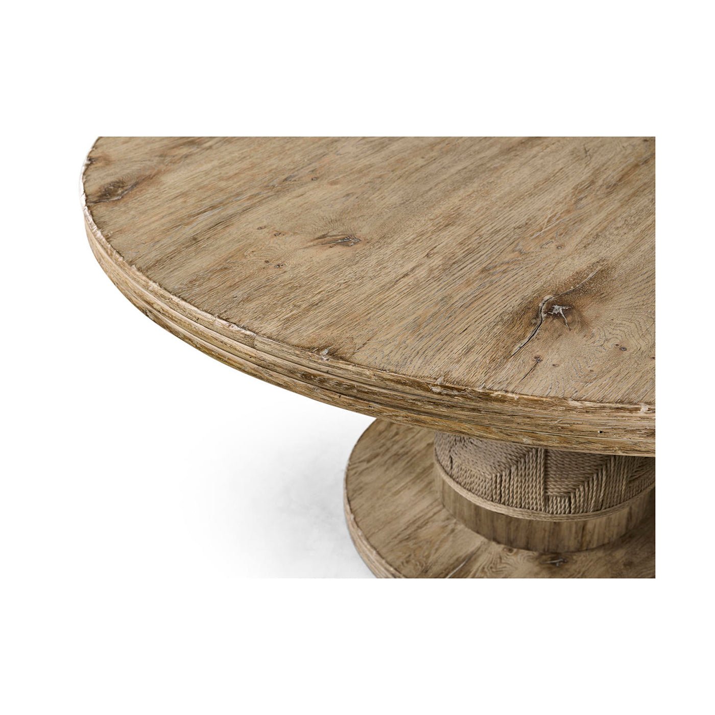 Edge detail of round rustic pedestal dining table.