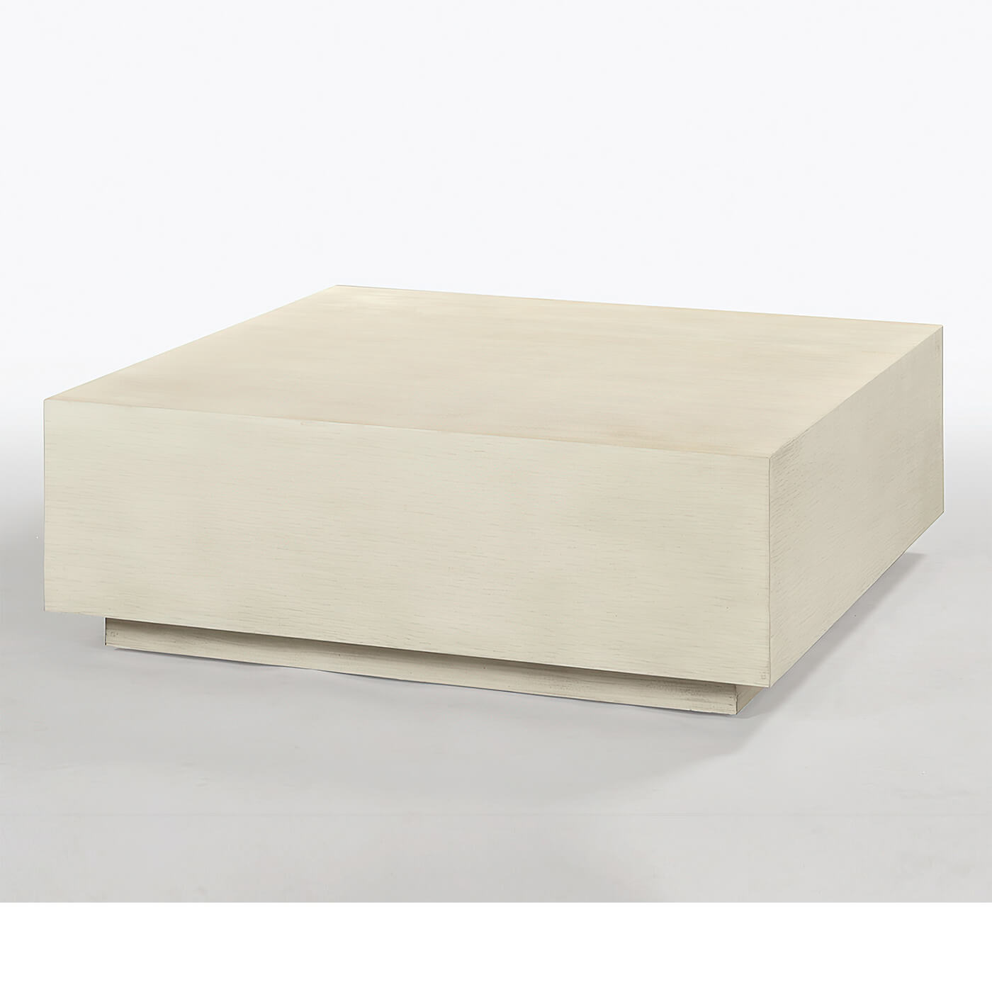 Coffee table in drift white, angled view on gray background.