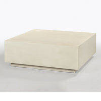 Coffee table in drift white, angled view on gray background.