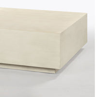 Close-up corner of square drift white coffee table.