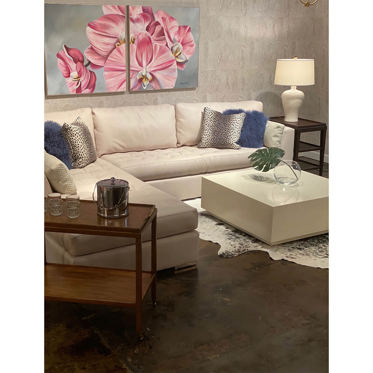 Drift white coffee table in living room setting with decor.