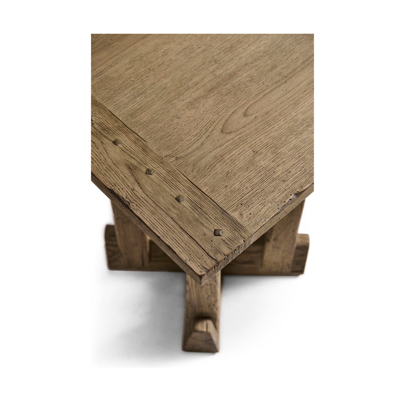 Corner detail of rustic modern table with nail accents.