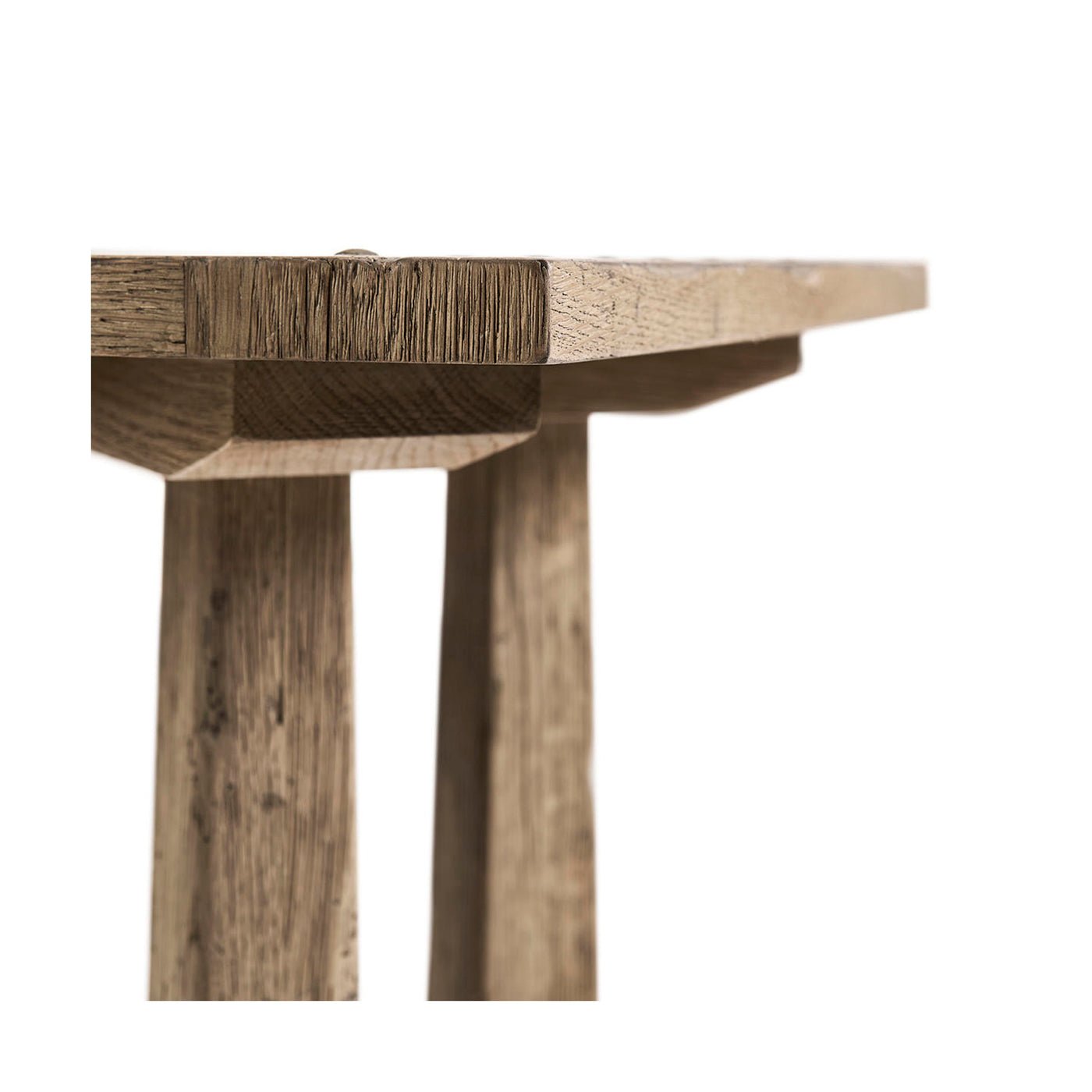 Close-up side view of rustic modern table surface.