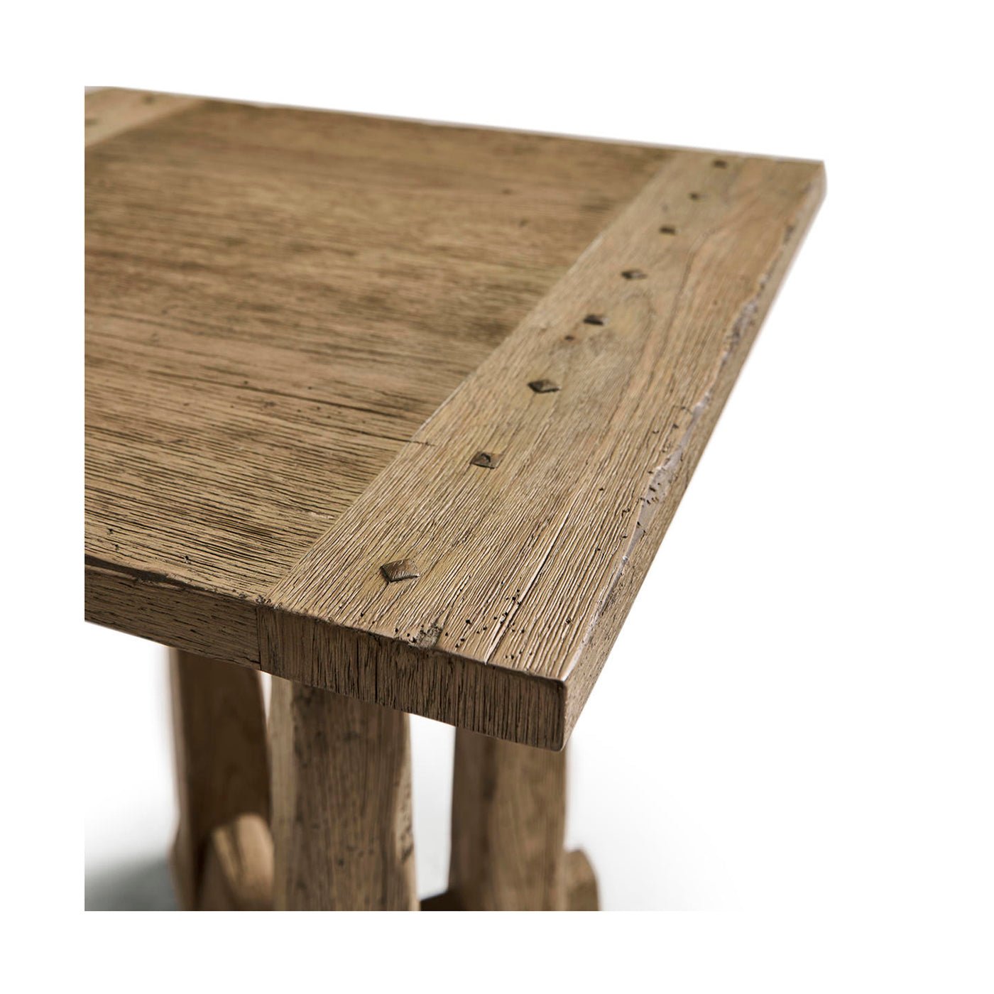 Close-up corner of rustic table showing texture and design.