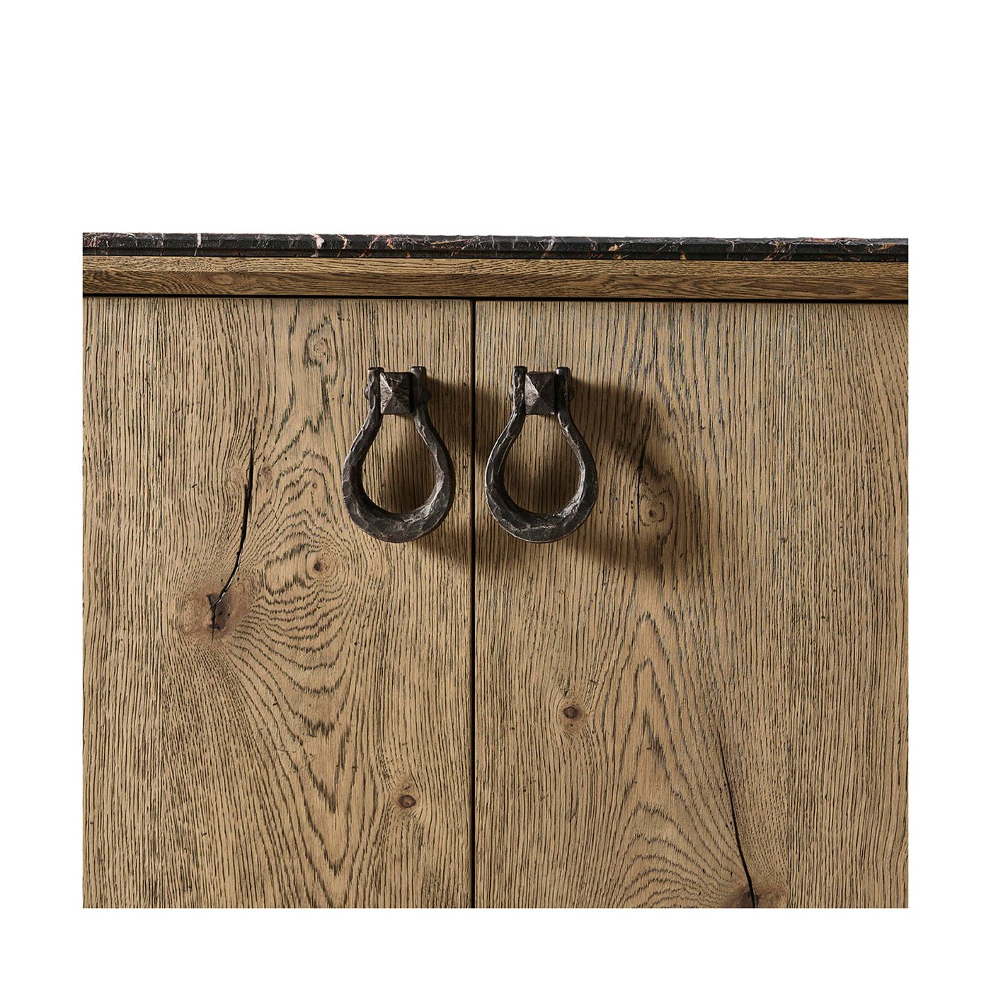Cabinet doors with ring handles on oak buffet.