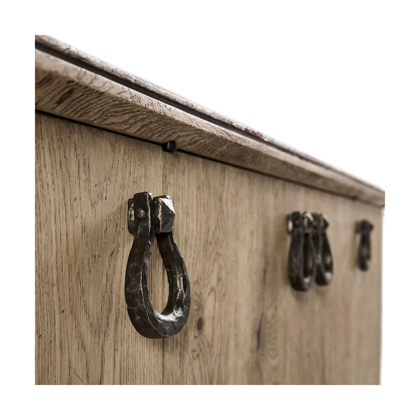 Close-up of ring handles on oak buffet.