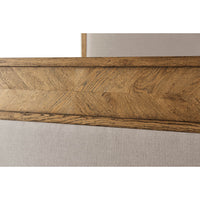 Close-up of wood and upholstery detailing on canopy bed.