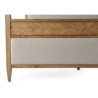 Detailed view of footboard on oak canopy bed.