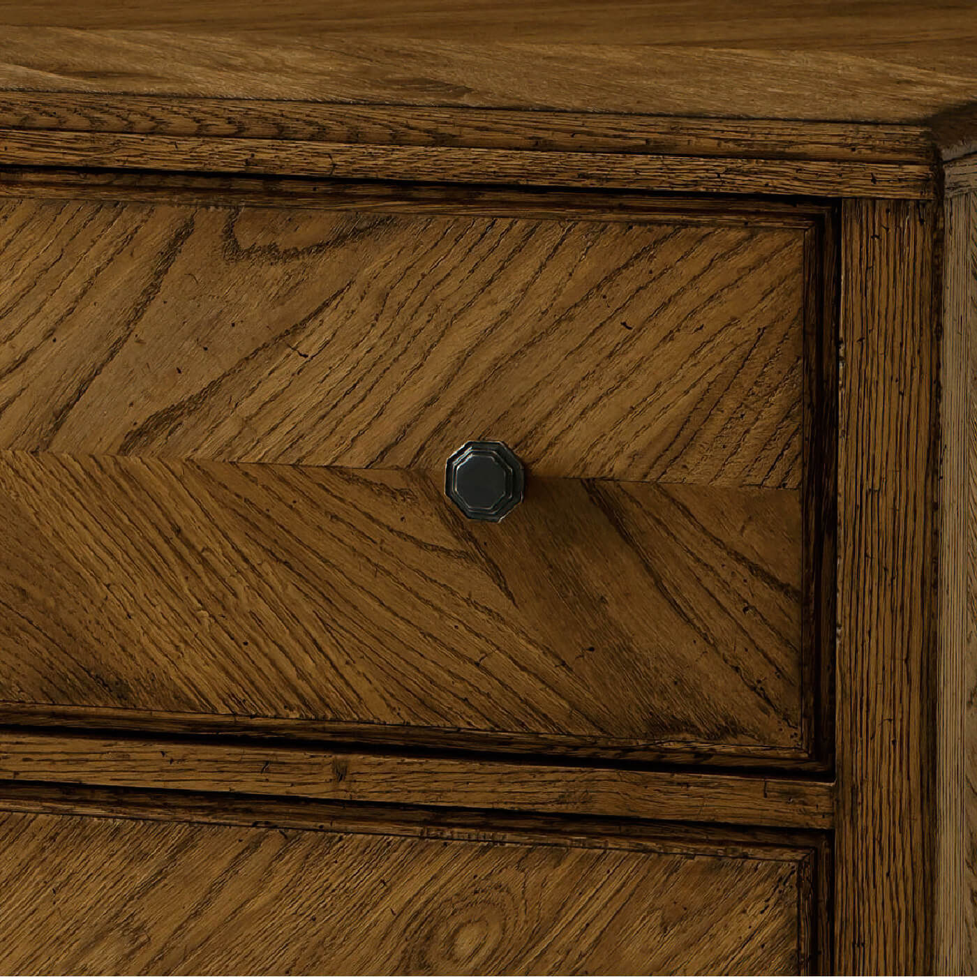 Drawer and knob detail on dark oak chest.
