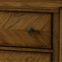 Drawer and knob detail on dark oak chest.