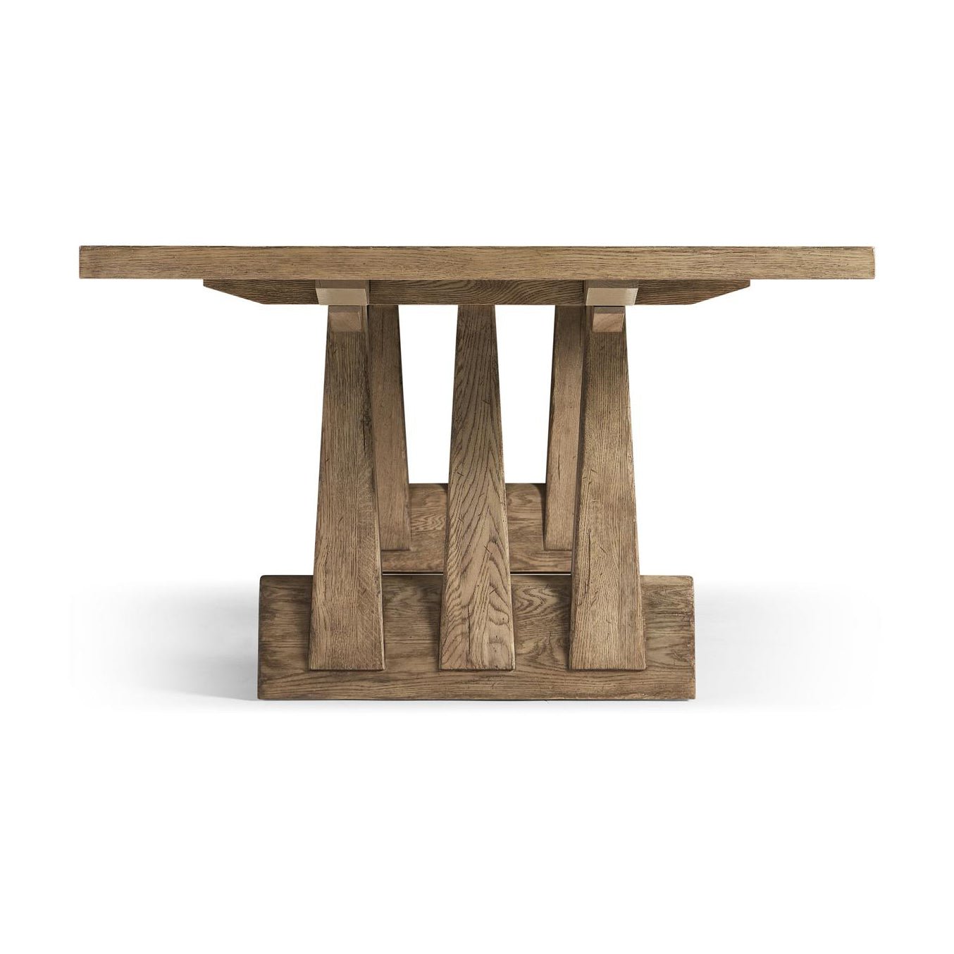 Rustic oak dining table, end view highlighting base design.