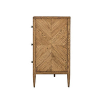 Side view of oak dresser, parquetry detail visible.