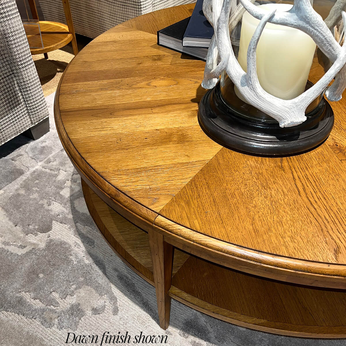 Round rustic table top detail with candle.