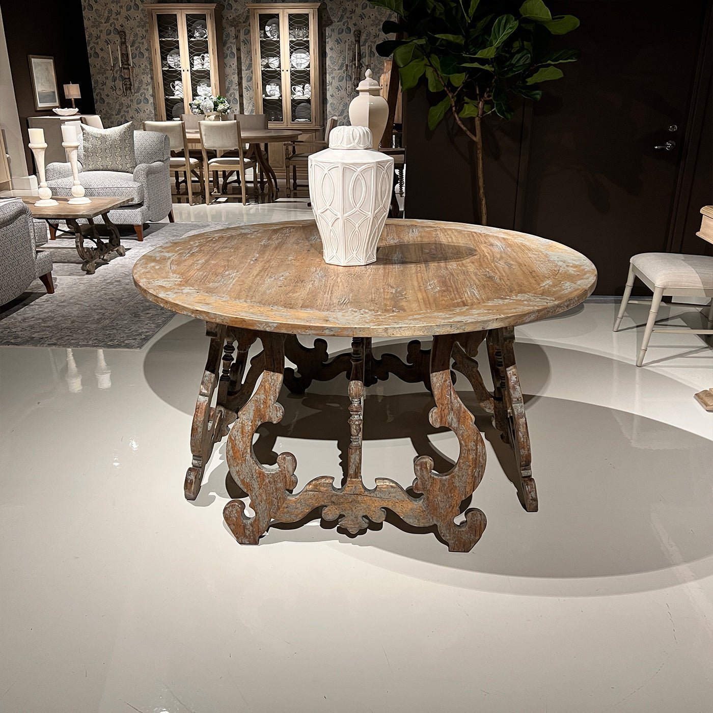 Decorative center table with vase in showroom setting.