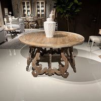 Decorative center table with vase in showroom setting.