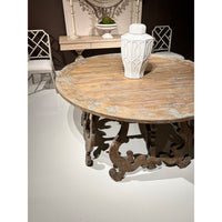 Rustic center table with vase, close-up perspective.