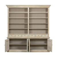 Rustic painted bookcase with open lower cabinet doors.