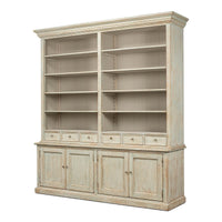 Angled view of rustic painted bookcase with shelves and doors.