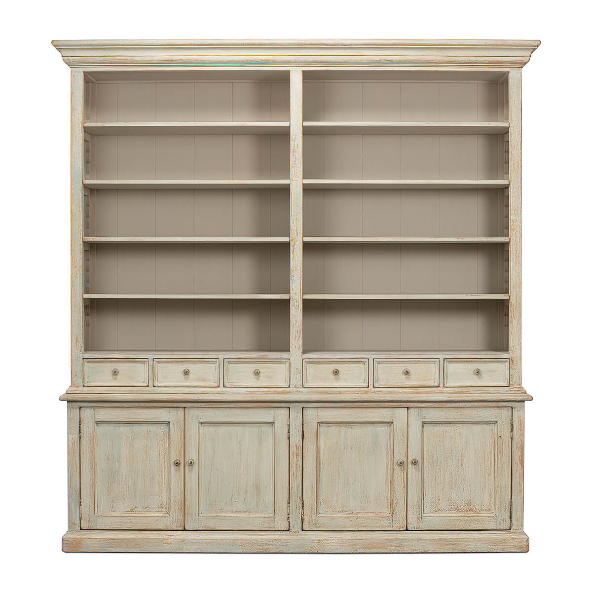 Front view of rustic painted bookcase with shelves and drawers.