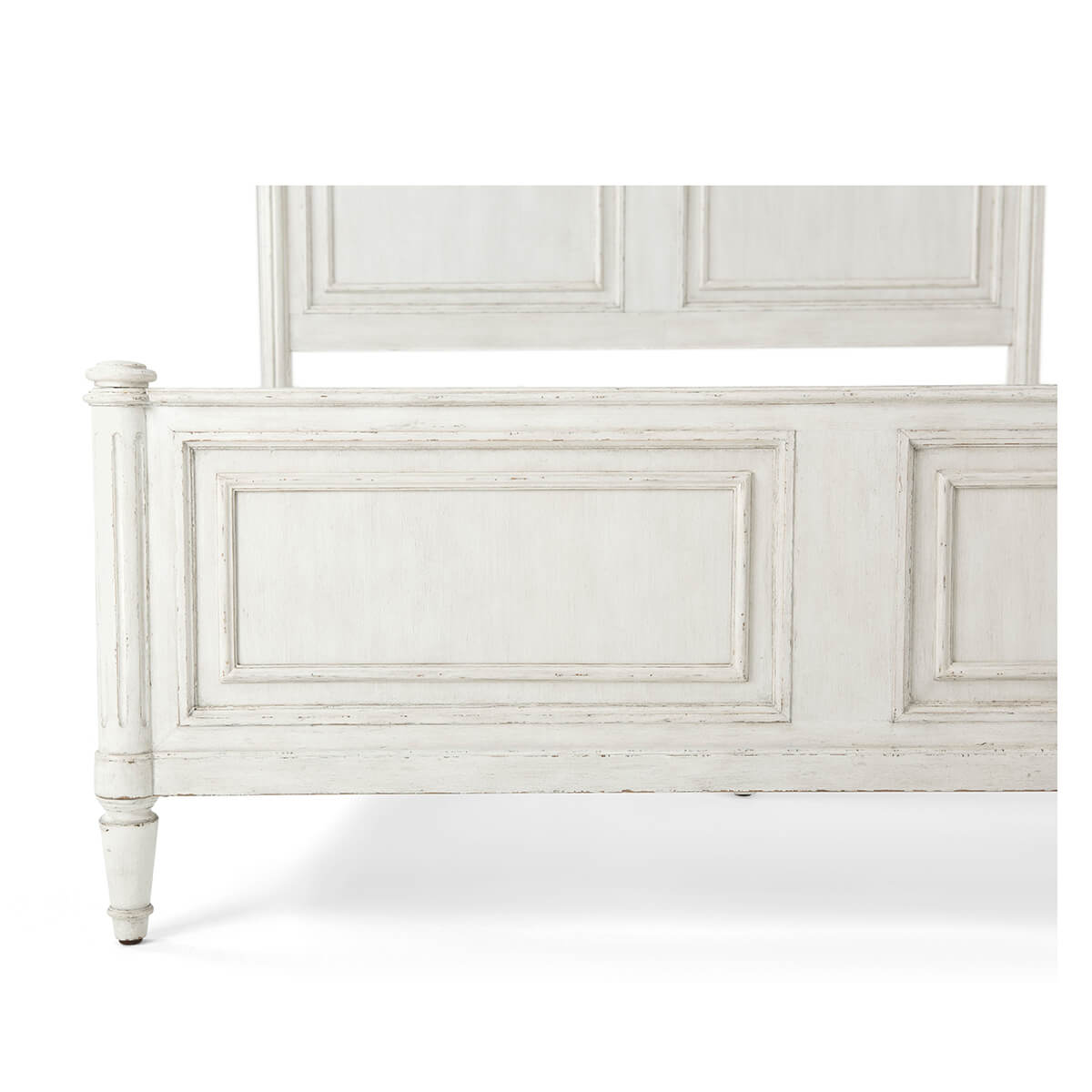 Close-up of footboard detailing on rustic queen bed.