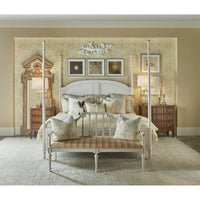 Rustic queen bed in decorated bedroom, styling view.