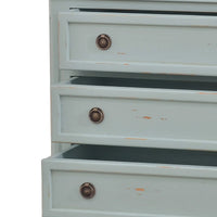Close-up, nightstand, open drawers with detailed handles.