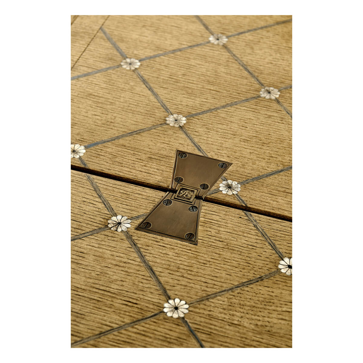 Close-up of parquetry design on dining table.