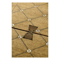 Close-up of parquetry design on dining table.