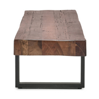 End view of the reclaimed wood bench showing the thick seat, visible grain and rectangular iron support