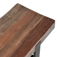 Close-up of the reclaimed wood bench seat showing varied brown grain, cracks and rustic surface marks