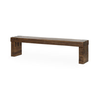 Reclaimed wood bench at an angle, with a thick brown plank seat and broad end legs