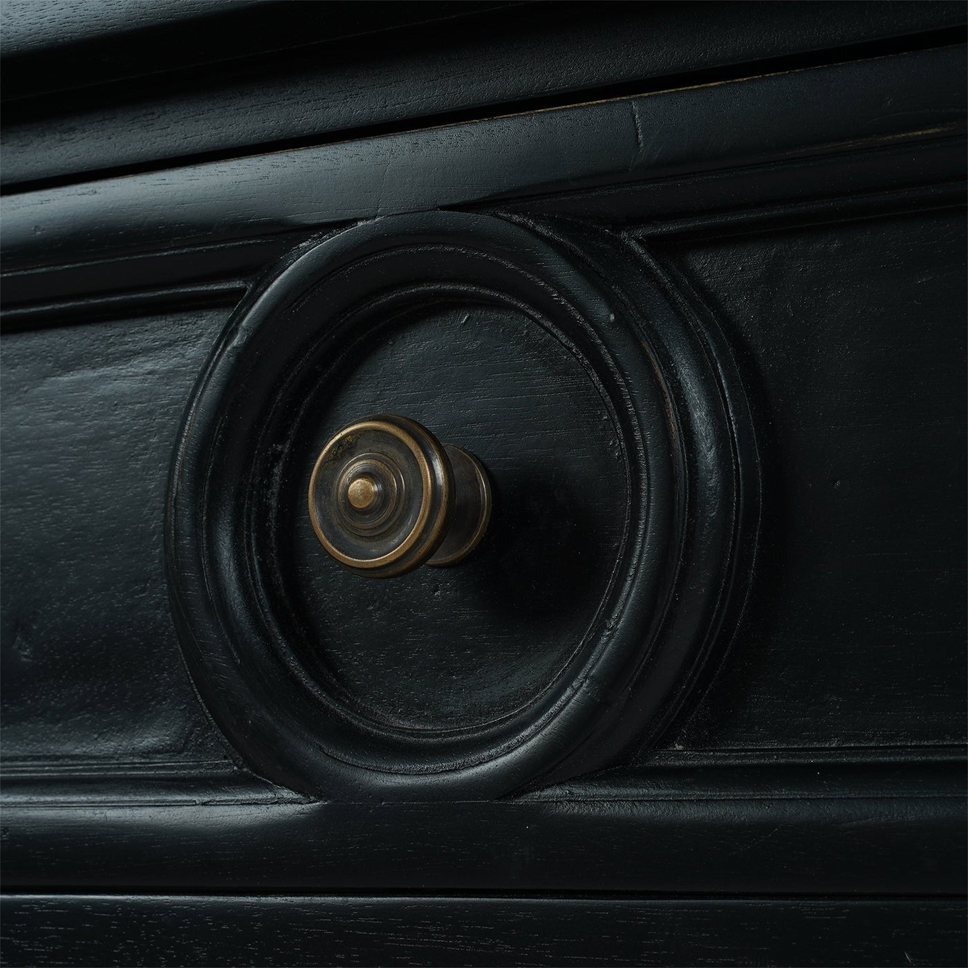 Rustic black end table drawer knob close-up