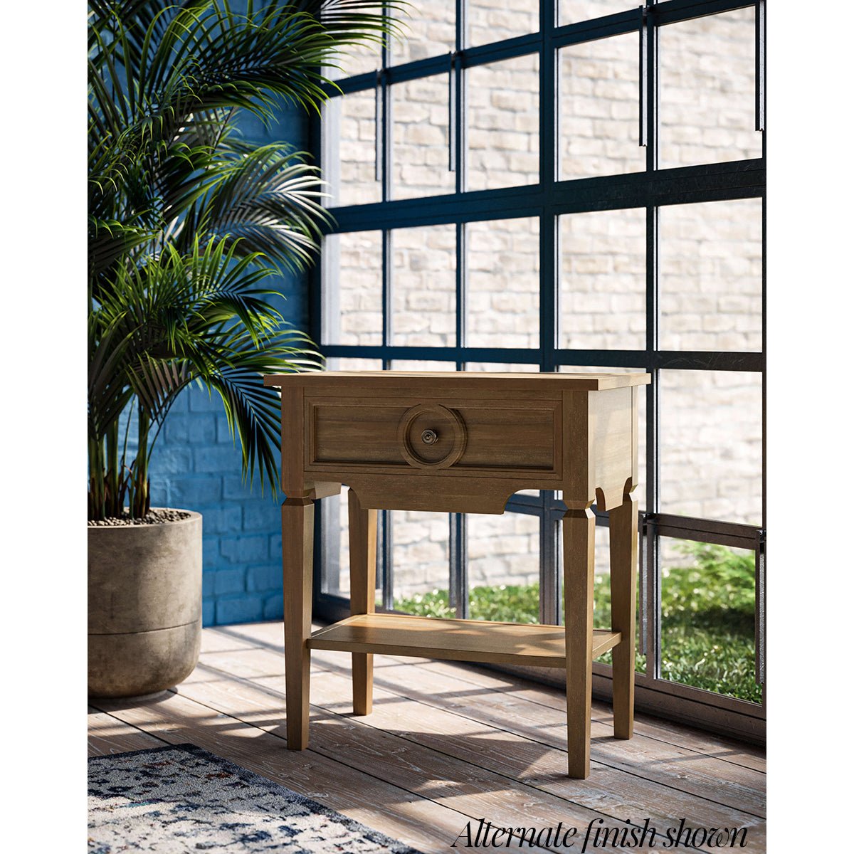 Rustic end table in bright interior with plants.