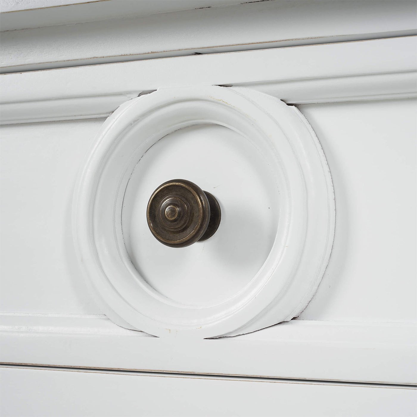 White end table, close-up of drawer knob and detailing.