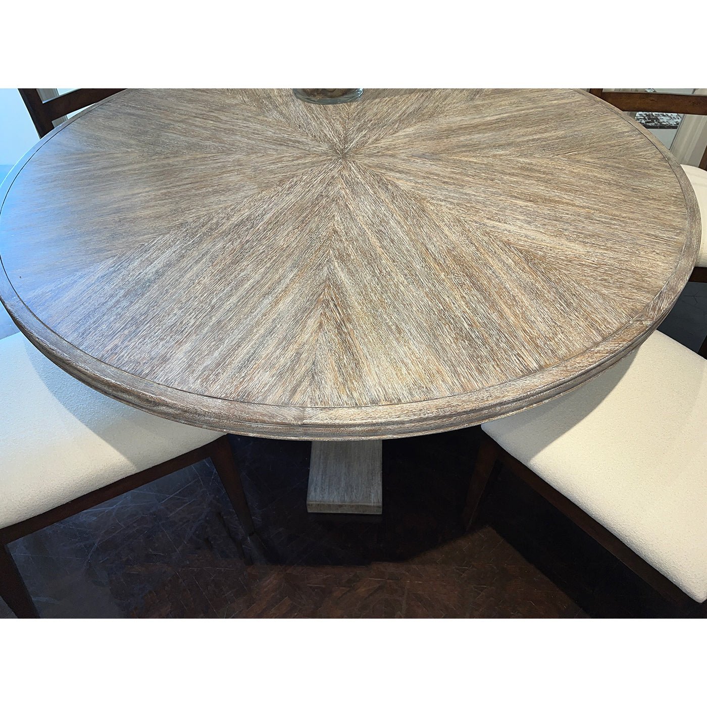 Close-up of dining table surface with wood grain pattern.