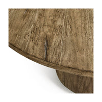 Close-up texture of rustic round pedestal dining table.