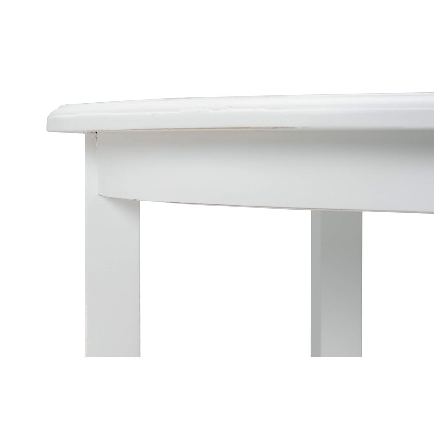 Close-up of white end table corner detail.