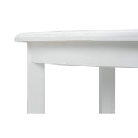 Close-up of white end table corner detail.