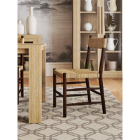 Rustic chair close-up in dining room, rush seat.