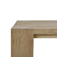 Close-up corner detail rustic teak coffee table.