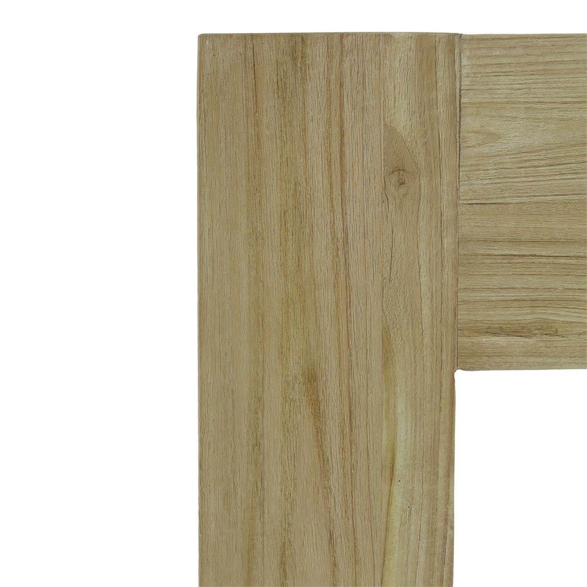 Corner detail of console table, natural wood finish.