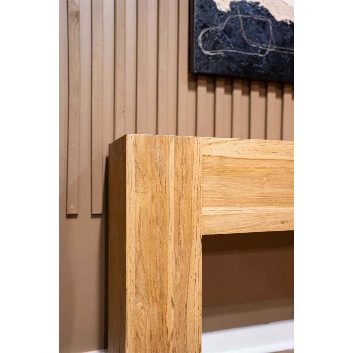 Close-up of console table edge, wood grain detail.