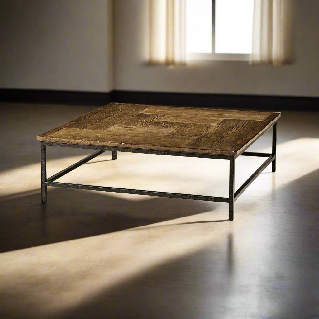 Rustic coffee table in sunlit room, square design, elegant style.