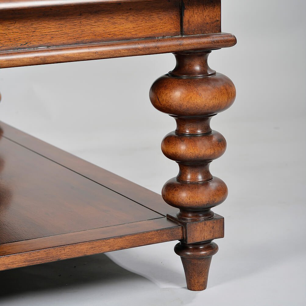 Close-up of coffee table's decorative turned leg design.